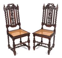 A Pair of Renaissance Revival Carved Oak Side Chairs Height 41 inches.