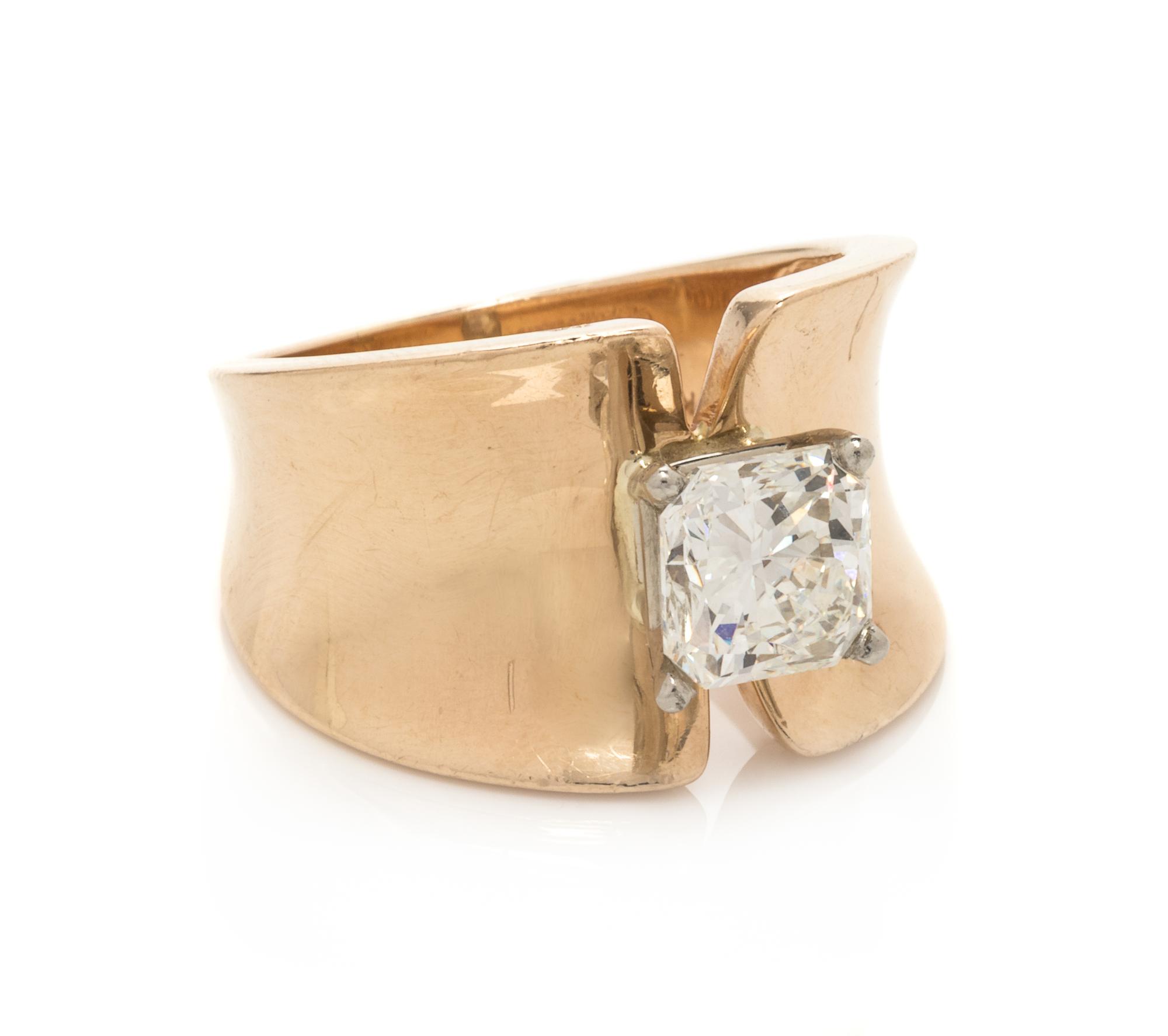 A 14 Karat Yellow Gold and Diamond Ring,