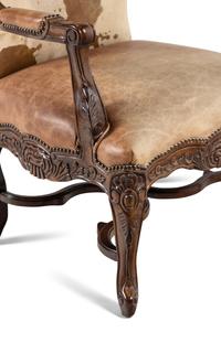 A Pair of Louis XV Style Carved Walnut Fauteuils