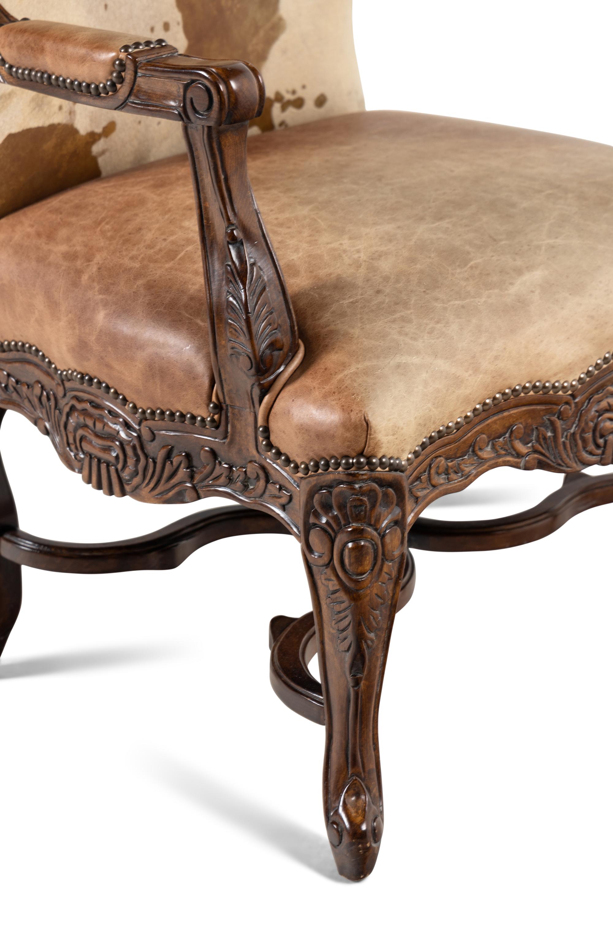 A Pair of Louis XV Style Carved Walnut Fauteuils