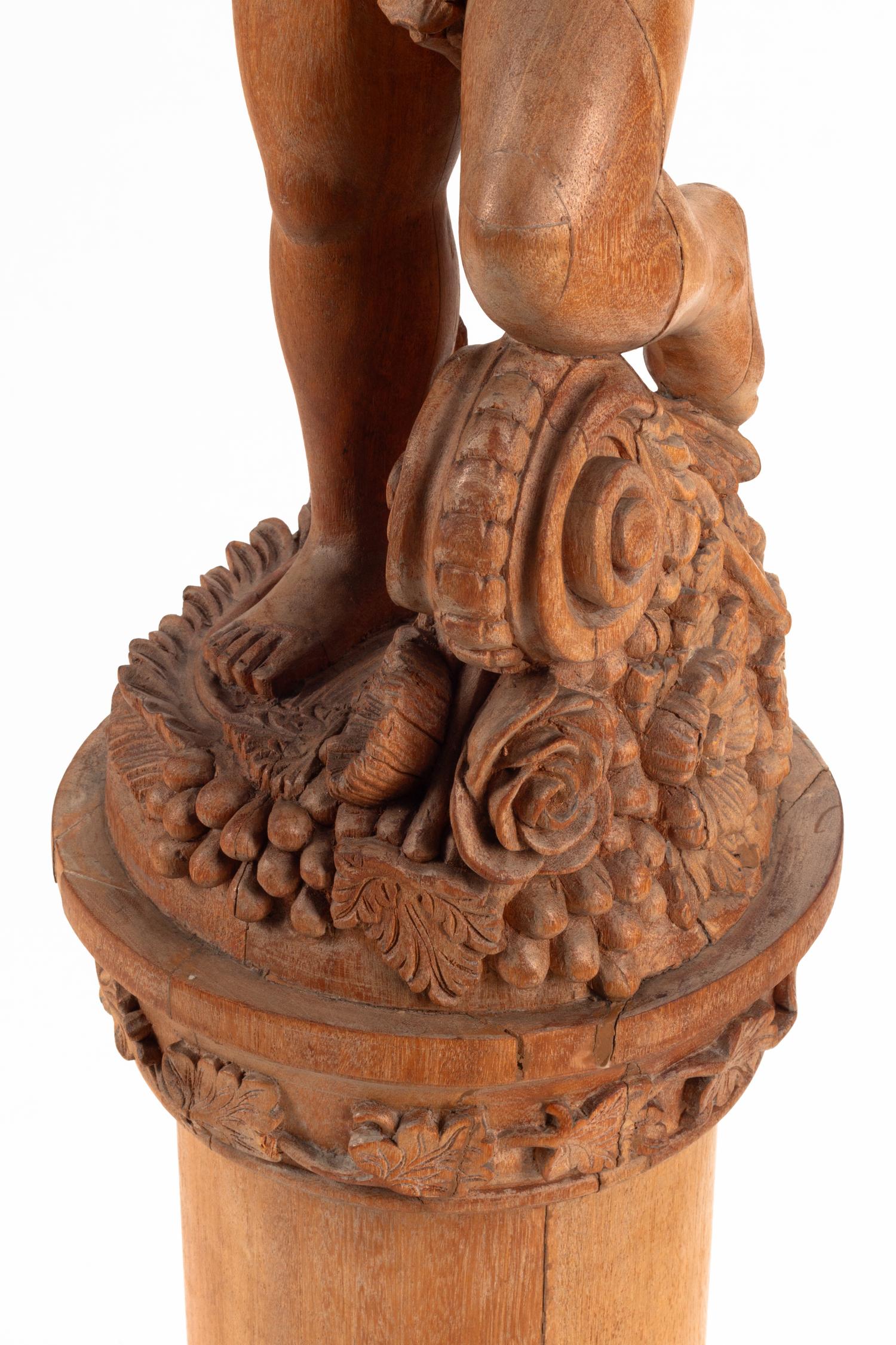 A Continental Carved Oak Figural Pedestal