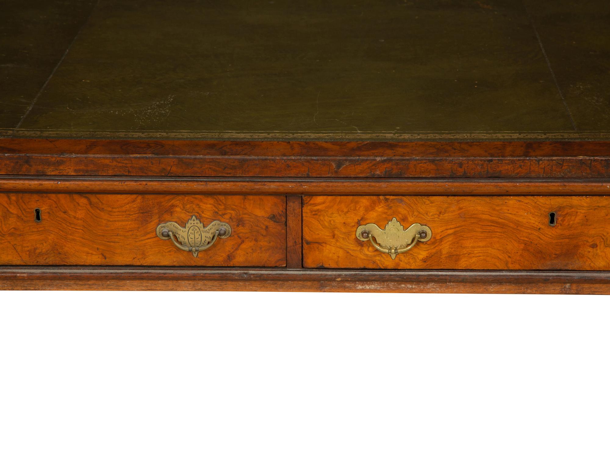 A Regency Burlwood Library Table with Black Leather Inset Top