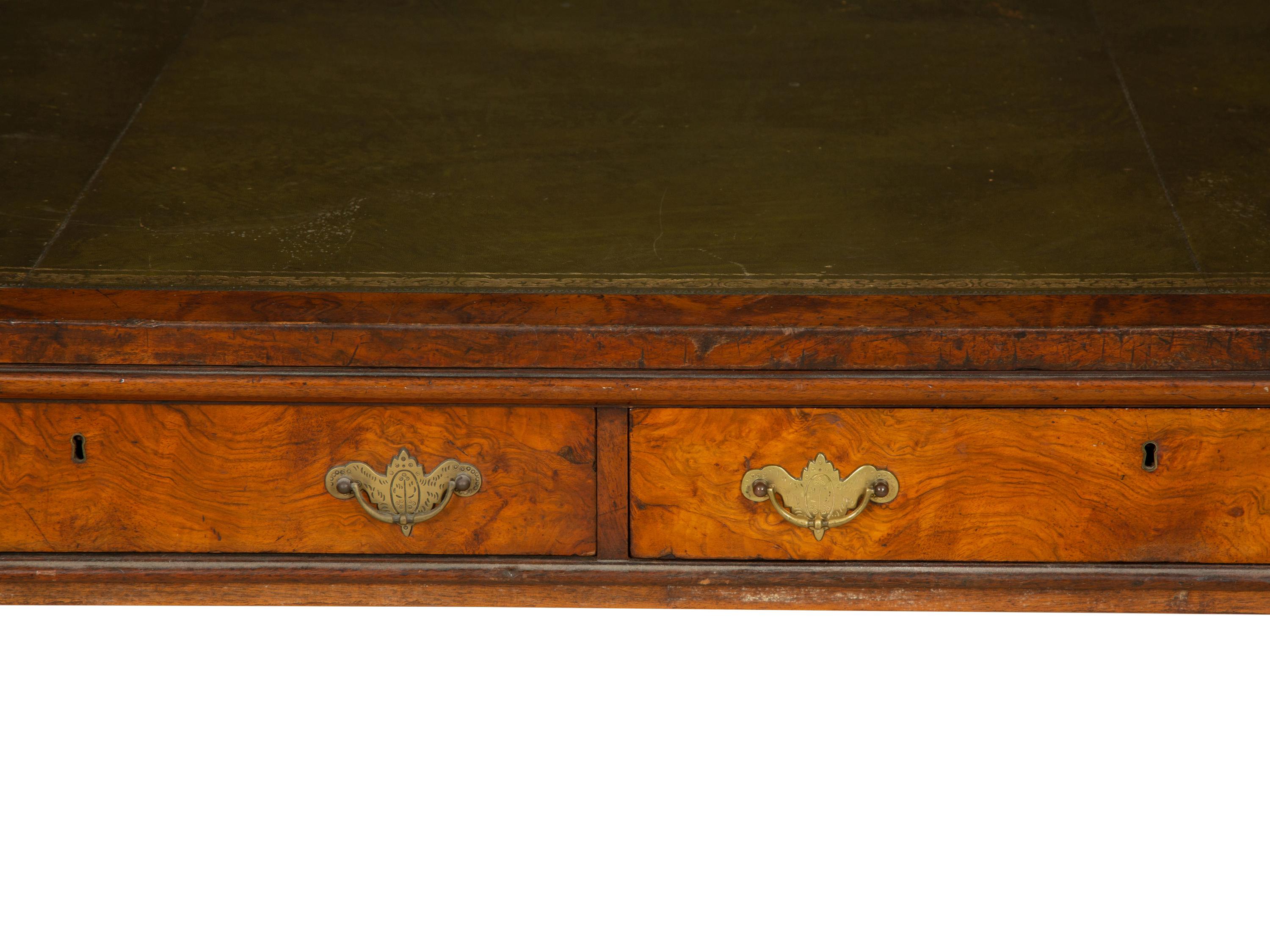 A Regency Burlwood Library Table with Black Leather Inset Top