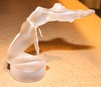 A Lalique Molded Glass Figure of a Woman. Height 5 1/2 inches.