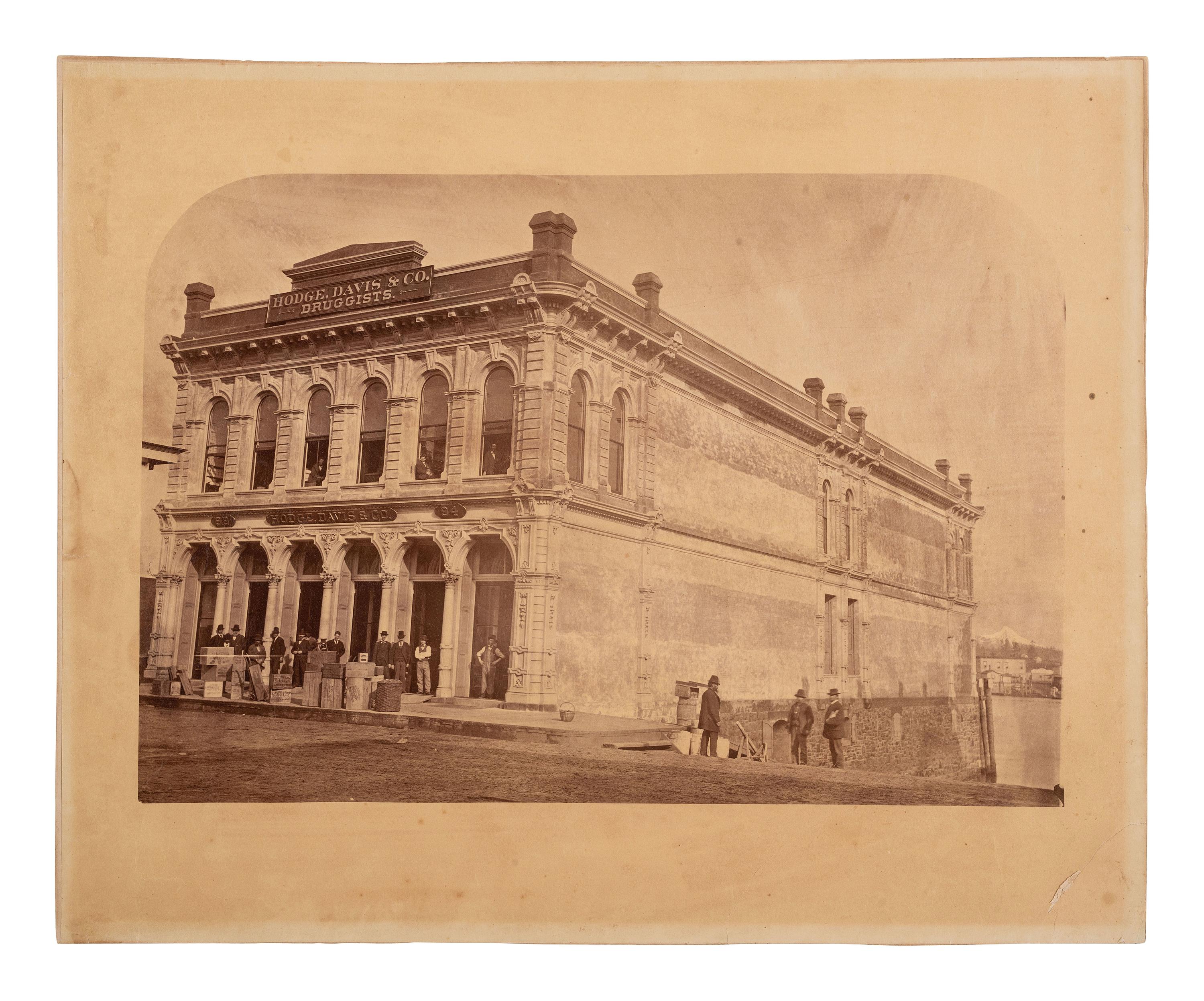 [EARLY PHOTOGRAPHY]. 2 large format photographs of storefronts, incl. Hodge, Davis & Co., Oregon.