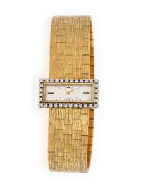 VACHERON & CONSTANTIN, 18K YELLOW GOLD BACKWIND WATCH WITH DIAMOND BEZEL