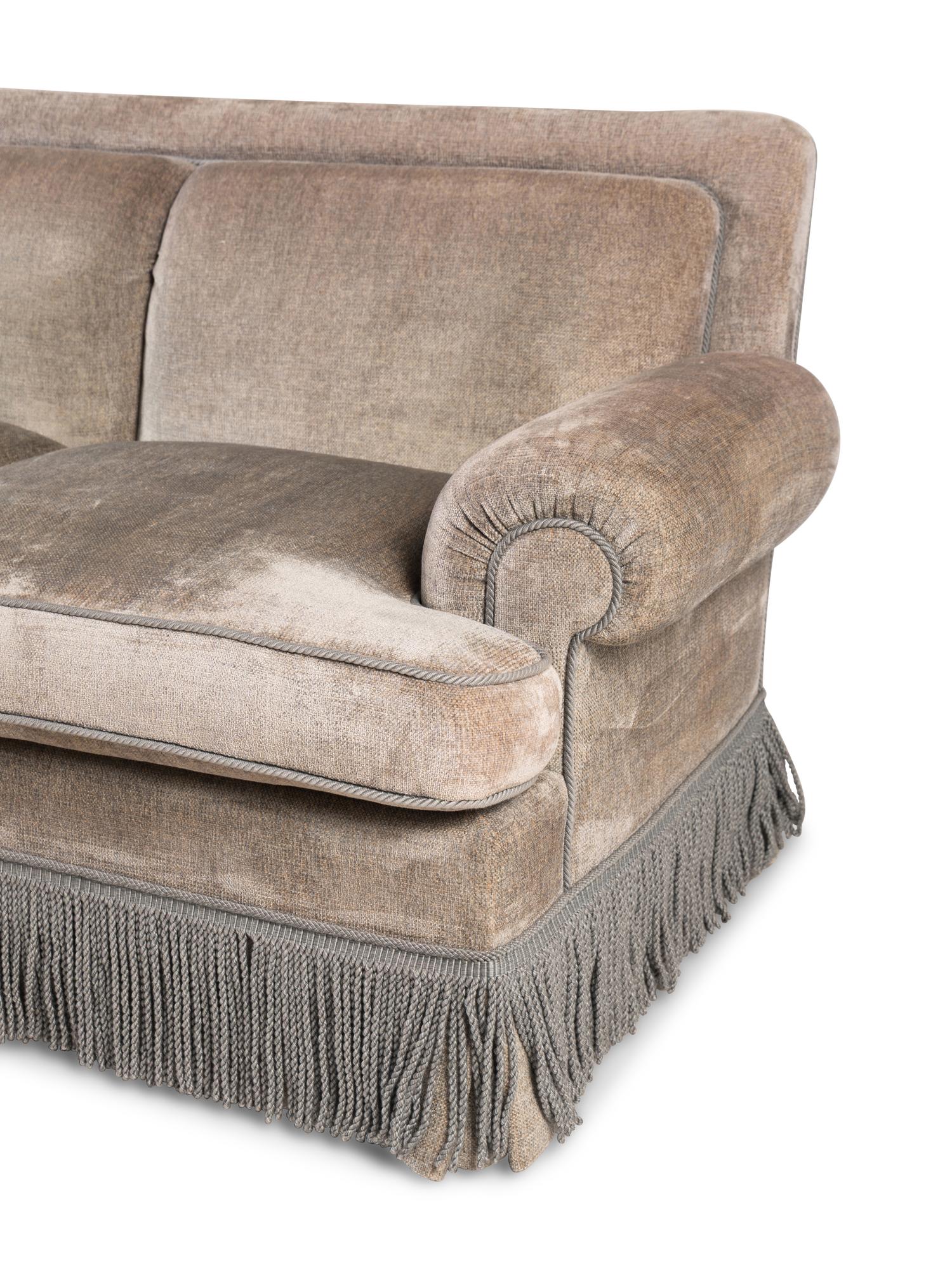 A Contemporary Three-Seat Sofa with Bullion Fringe
