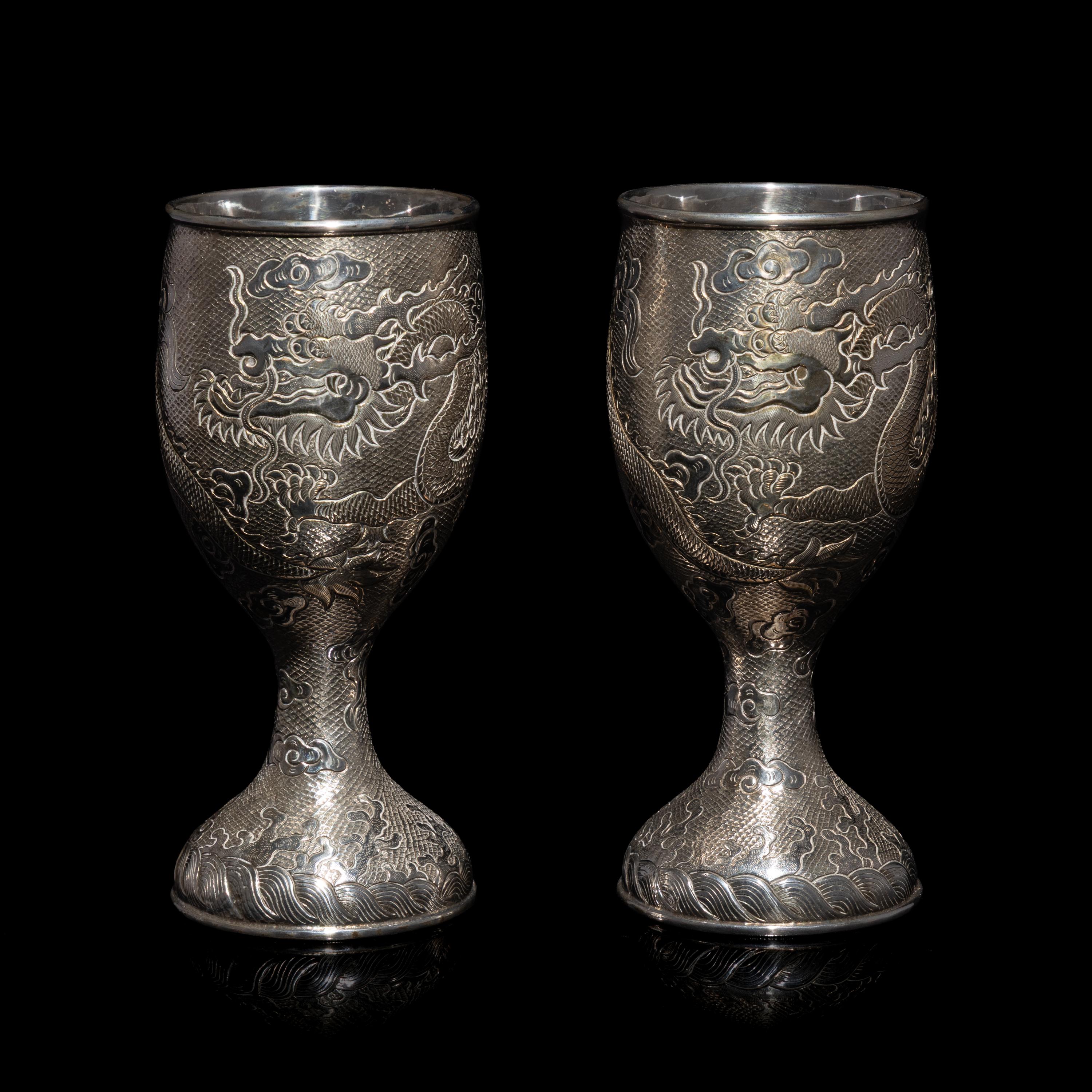A Pair of Chinese Export Silver 'Dragon' Wine Cups, 20th Century 近代 外銷鏨云龍紋酒杯一對