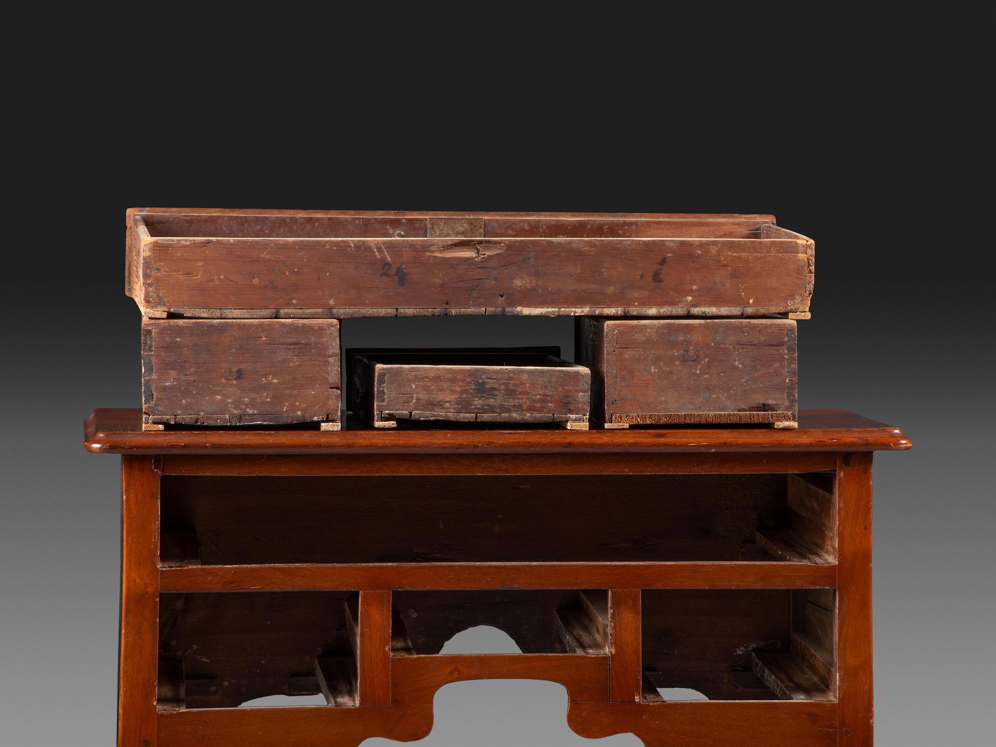 A Queen Anne Carved and Figured Walnut Dressing Table