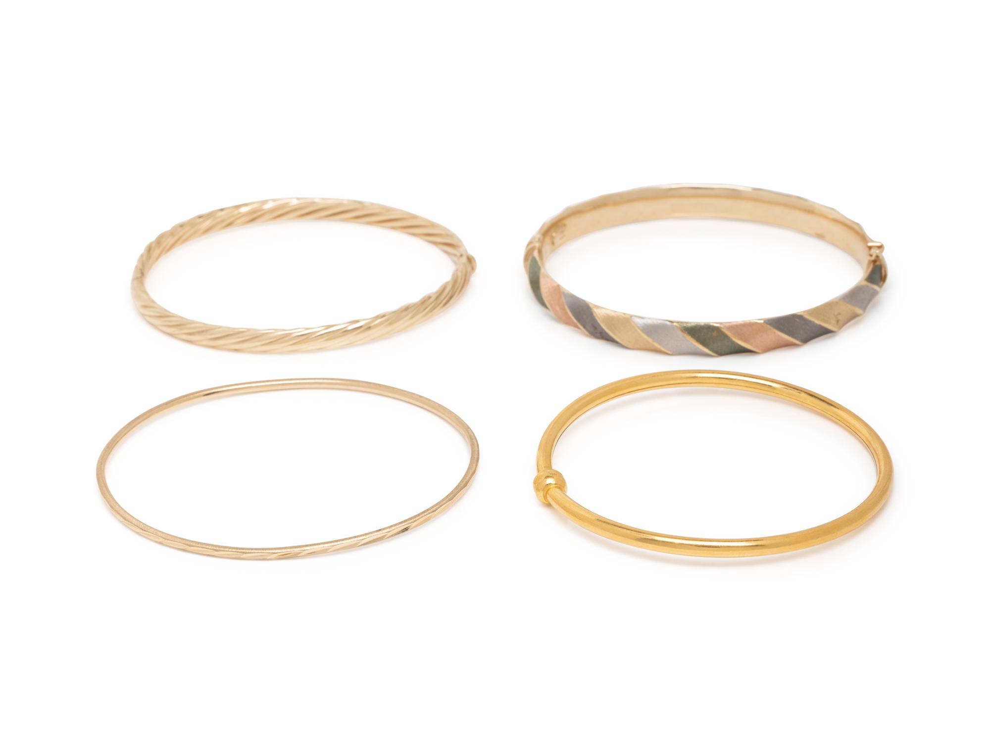 COLLECTION OF GOLD BANGLE BRACELETS