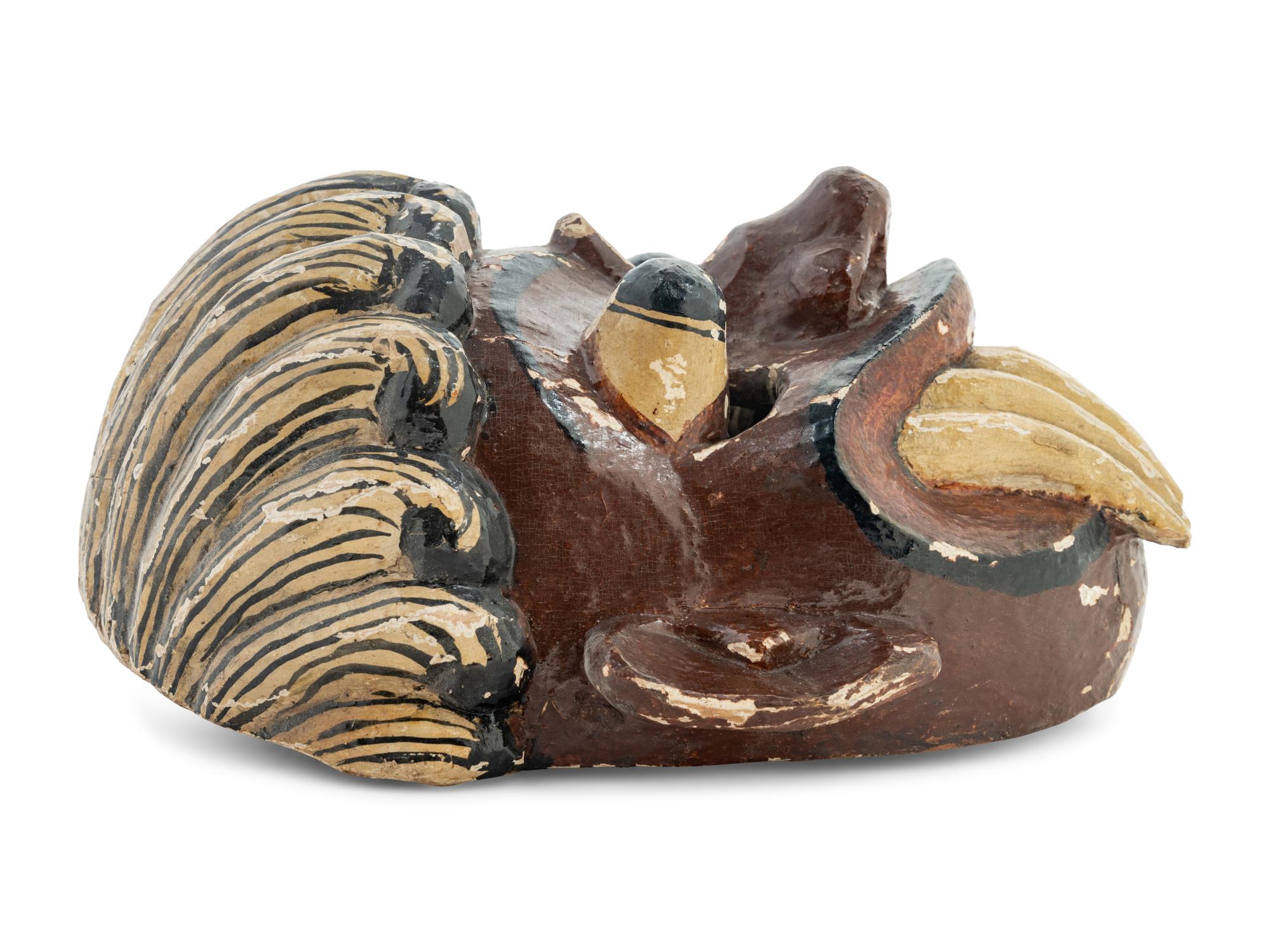 A Mexican Carved and Polychromed Wood Mask