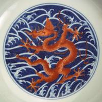 An associated pair of iron-red and underglaze blue "Dragon" Dishes 礬红青花龙纹盘子 或为一对 Qianlong six-character seal mark and of the period ????? ? ??