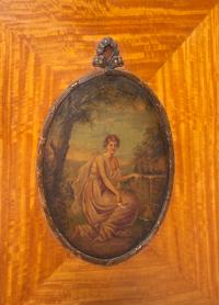 An Edwardian Painted Satinwood Bowfront Cabinet