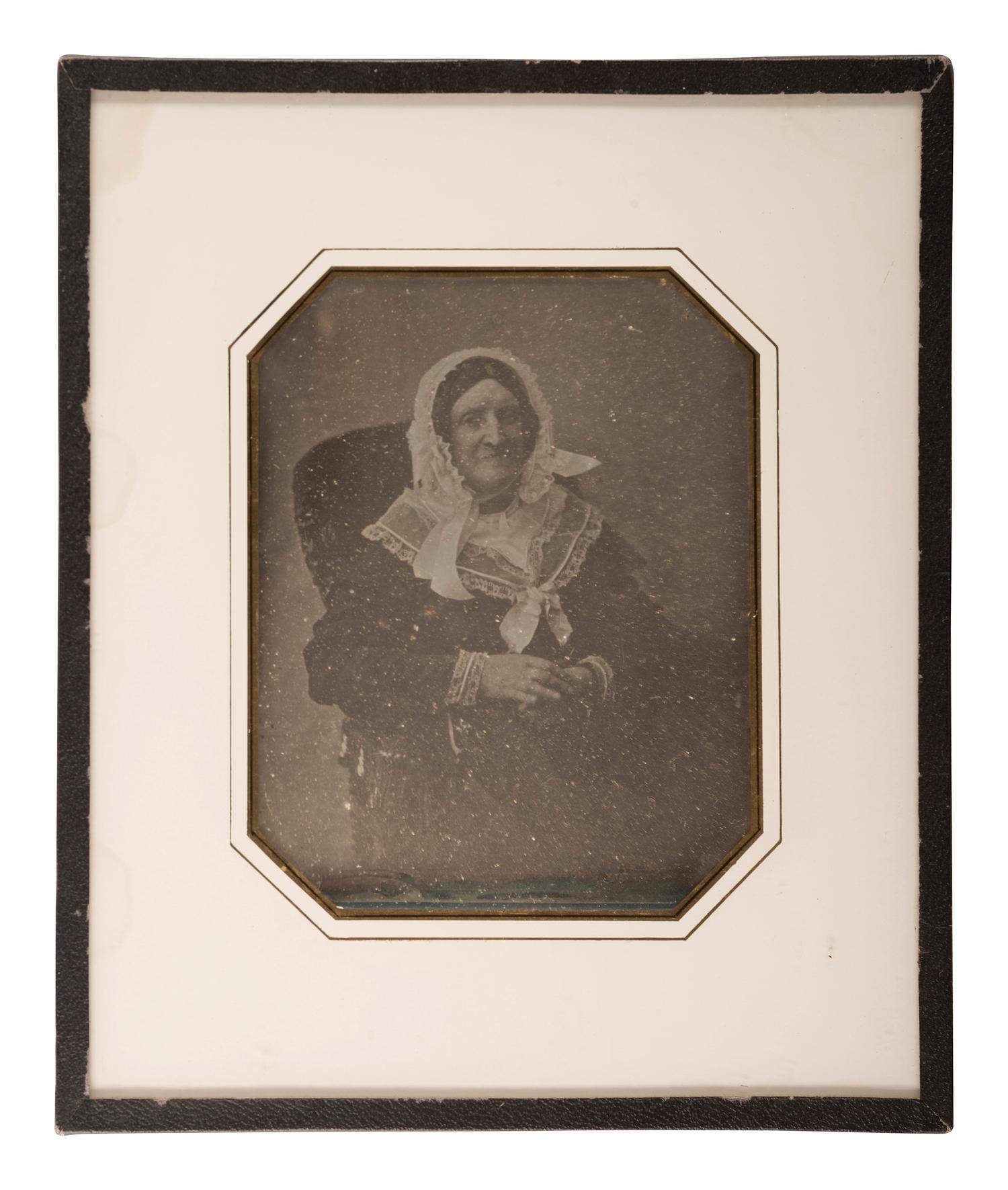 [EARLY PHOTOGRAPHY]. A group of 9 European portraits in wall frames, highlighted by attractive daguerreotypes of men, women, and children, including: