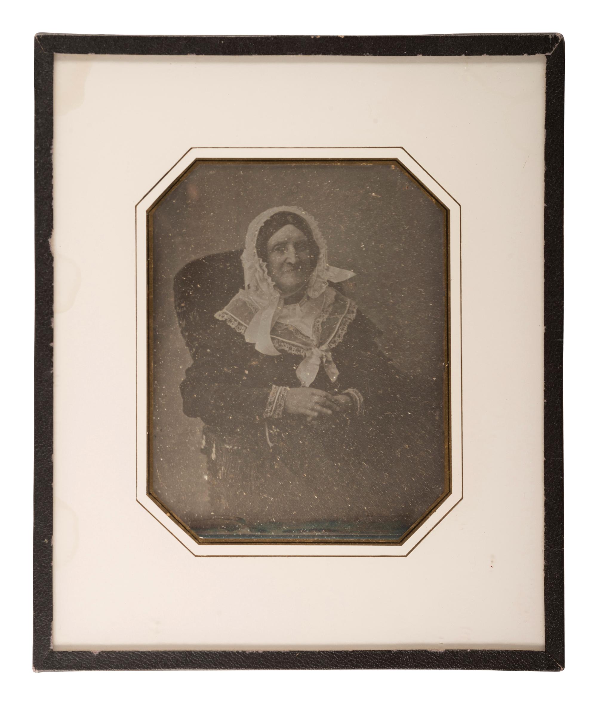 [EARLY PHOTOGRAPHY]. A group of 9 European portraits in wall frames, highlighted by attractive daguerreotypes of men, women, and children, including: