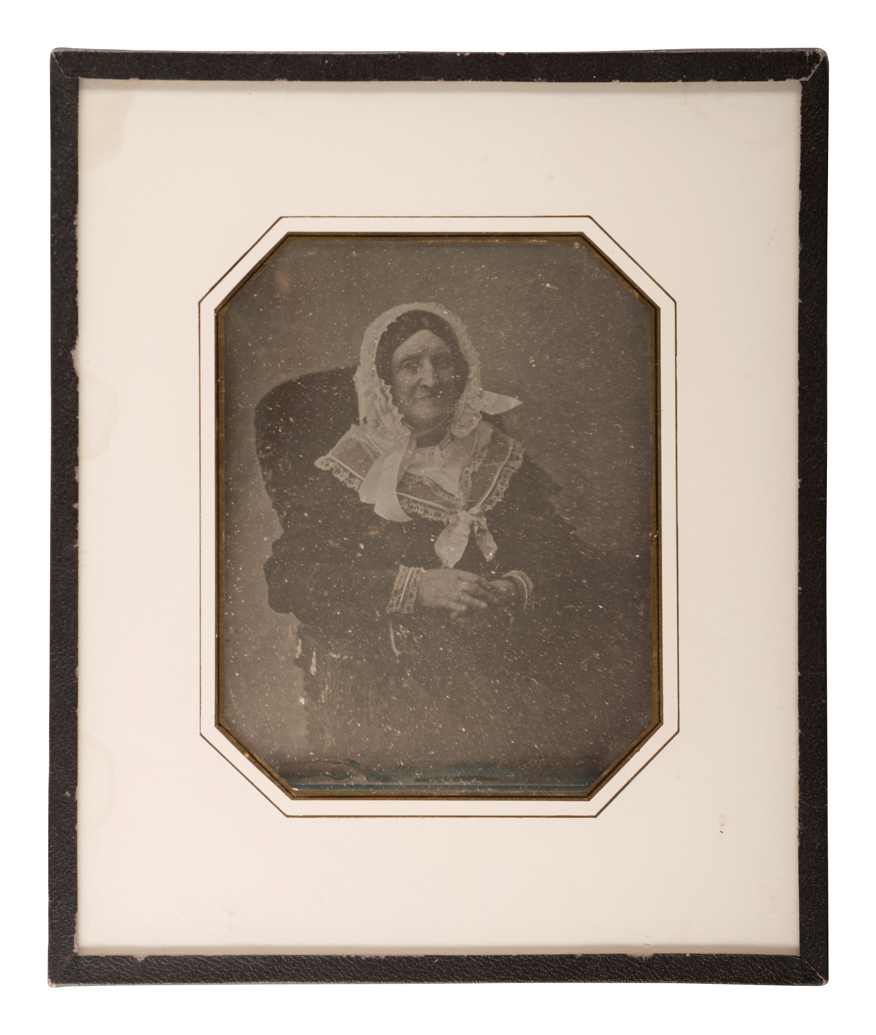 [EARLY PHOTOGRAPHY]. A group of 9 European portraits in wall frames, highlighted by attractive daguerreotypes of men, women, and children, including: