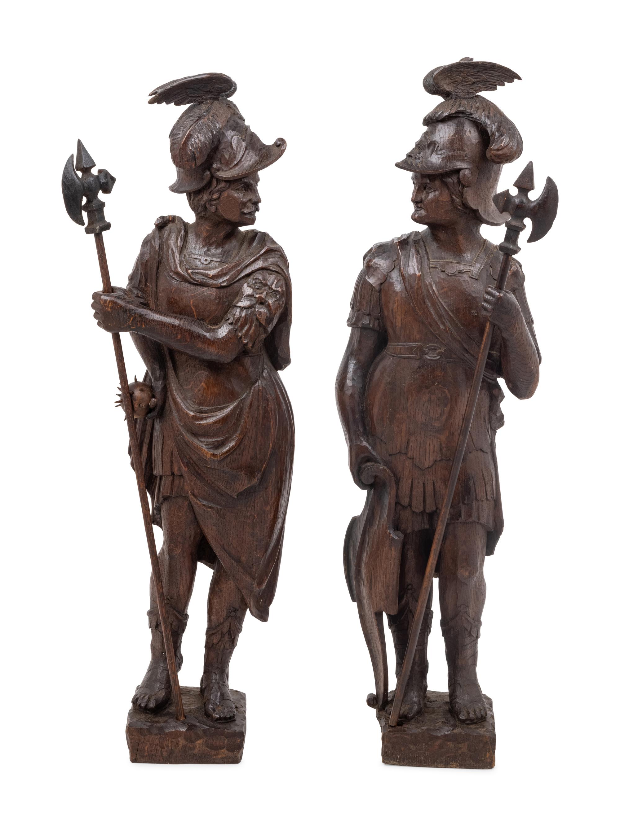 A Pair of Continental Carved Oak Figures of Knights