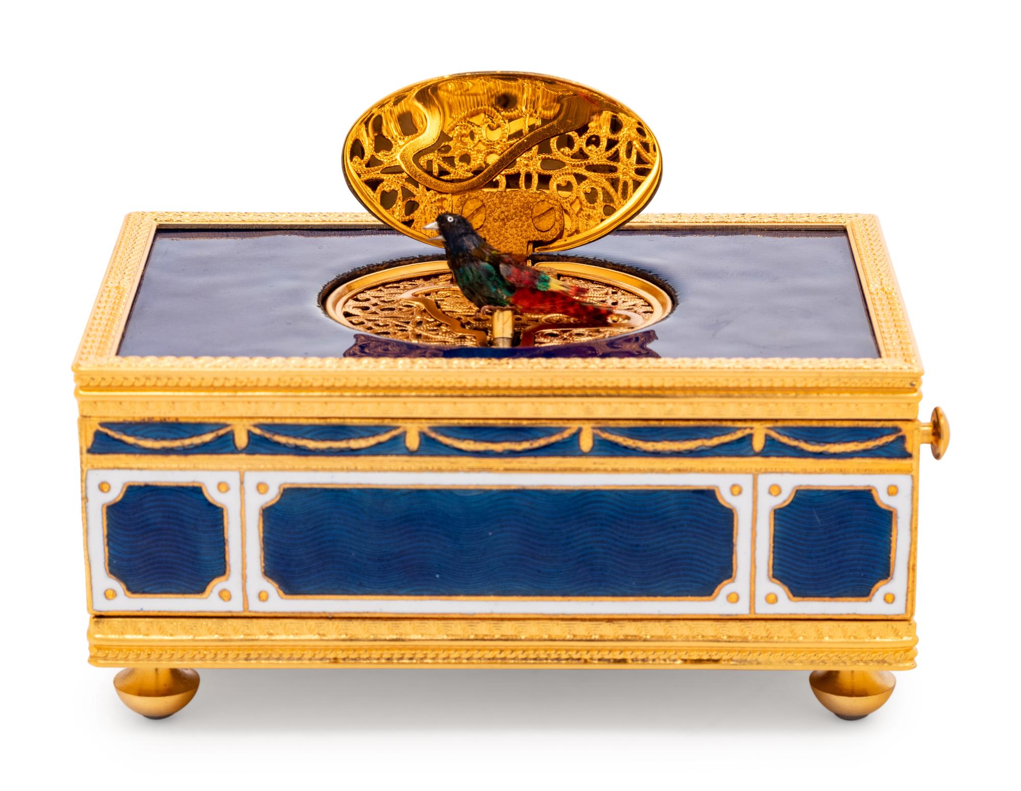 A Reuge Gilt Metal Mounted and Rhinestone-Inset Enameled Singing Bird Automaton Box