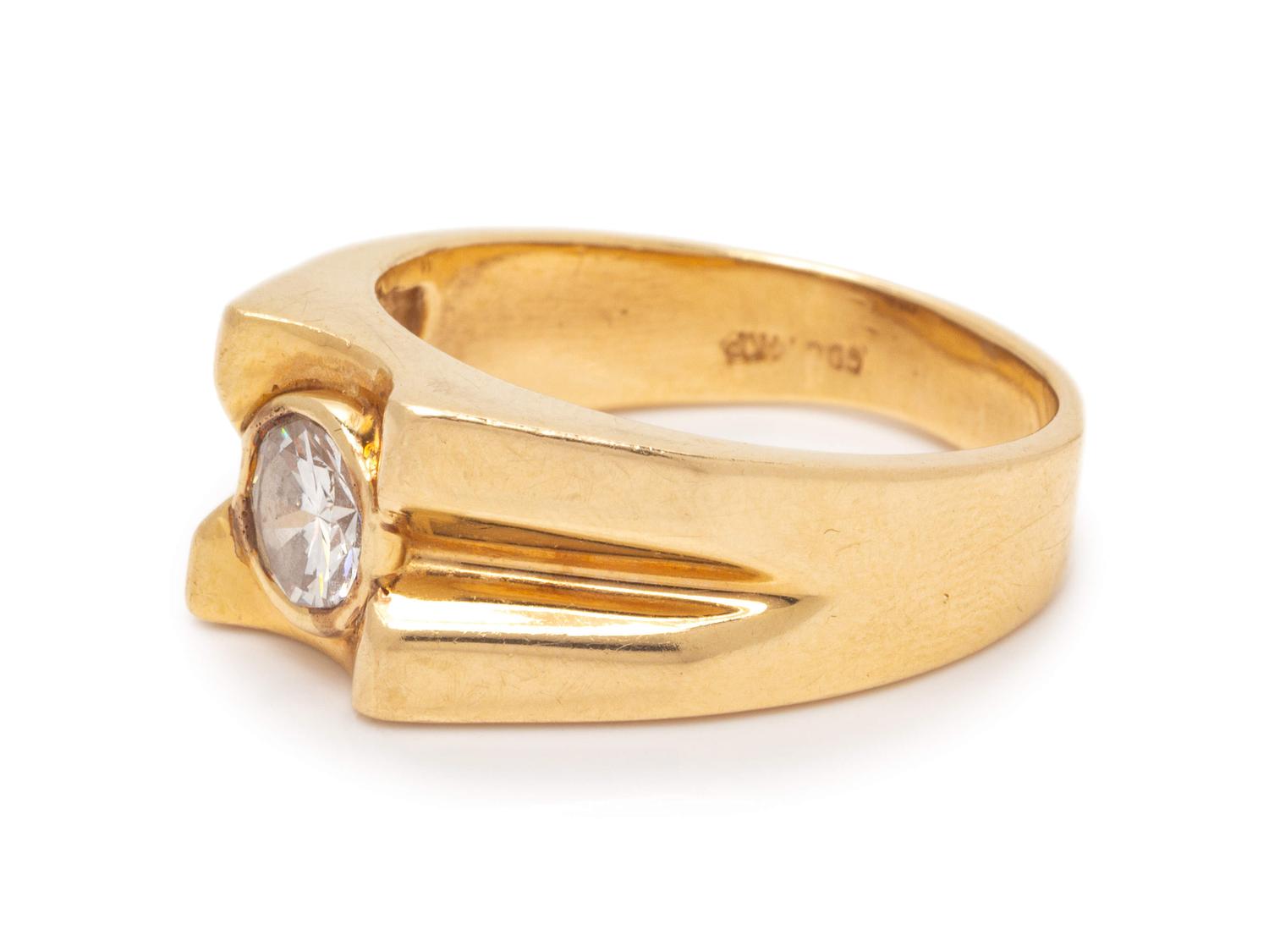 A 14 Karat Yellow Gold and Diamond Ring,