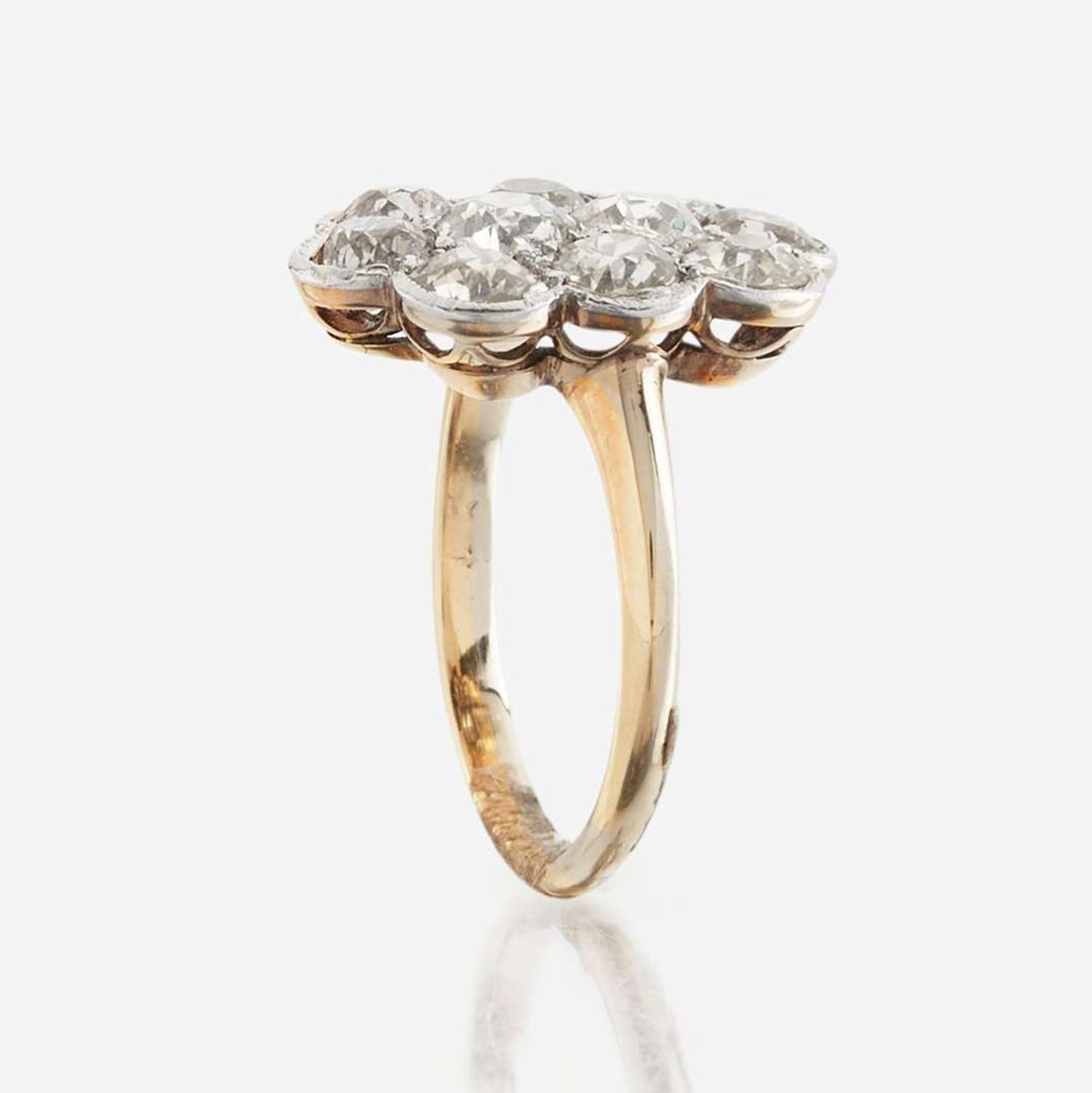 A diamond and platinum topped gold ring