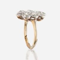 A diamond and platinum topped gold ring