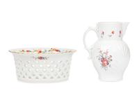 A Mottahedeh Porcelain Pitcher and Centerpiece Basket