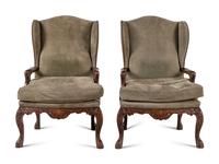 A Pair of Régence Style Suede Upholstered Walnut Wingback Fauteuils