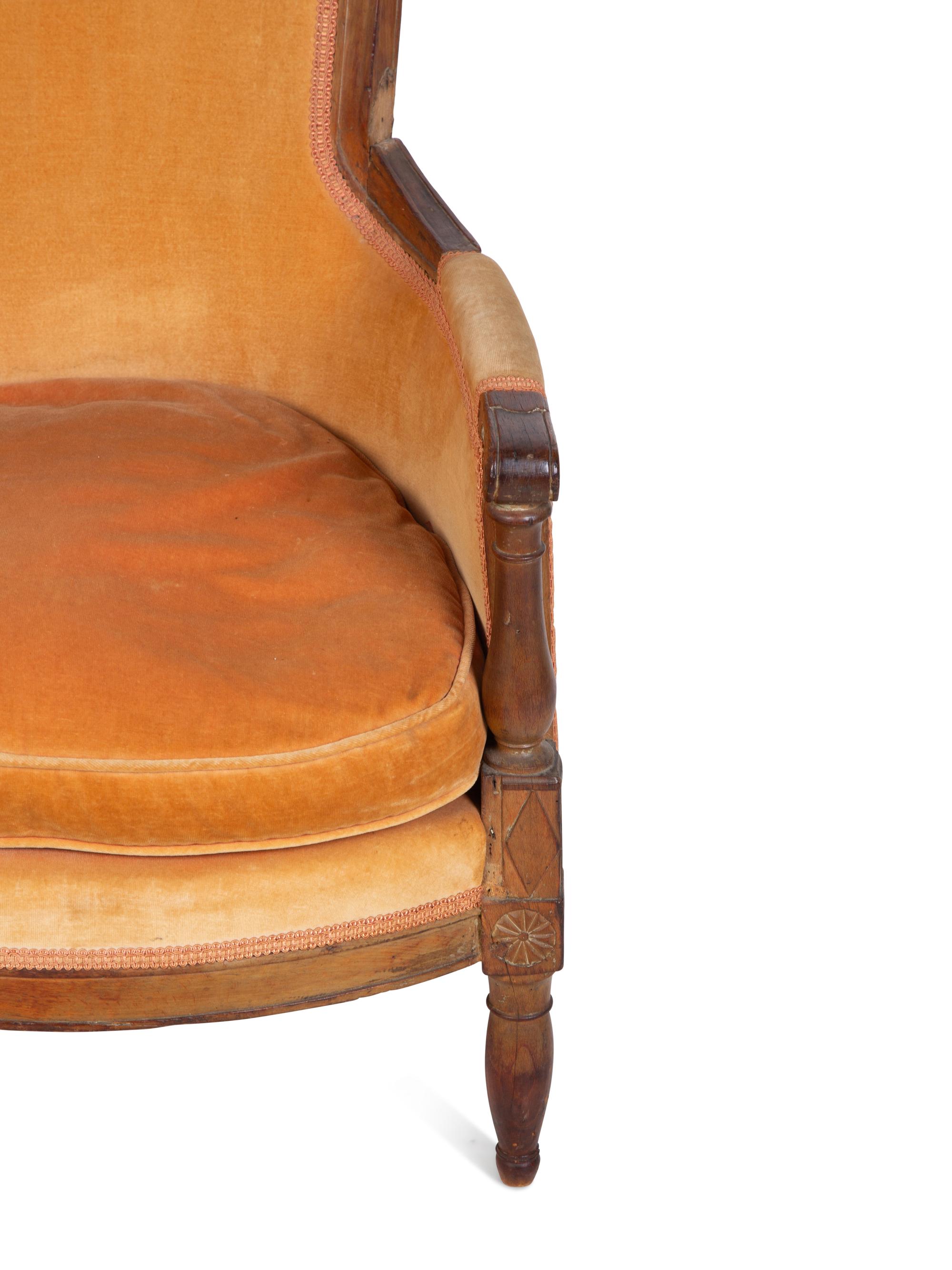 A Diminutive Directoire Carved Fruitwood Bergère — CIRCA 1790