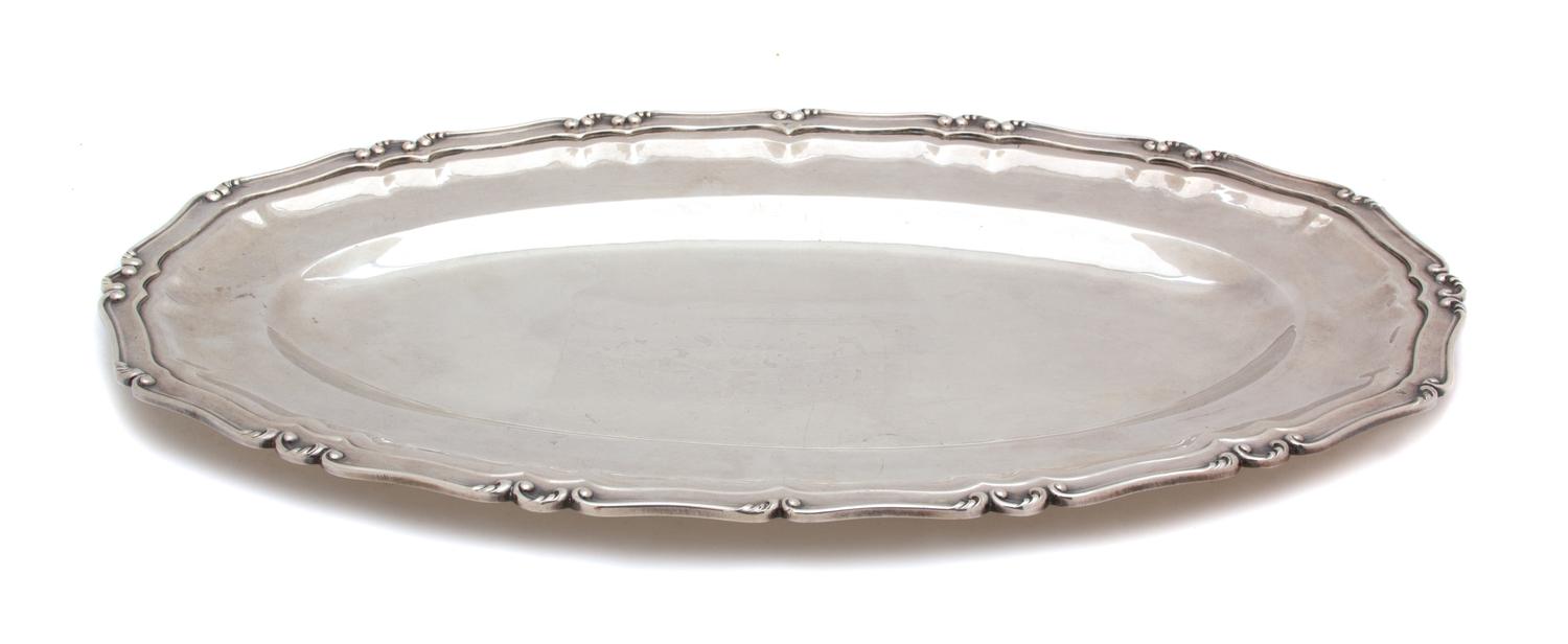 A Peruvian Silver Oval Platter, , having C-scroll border