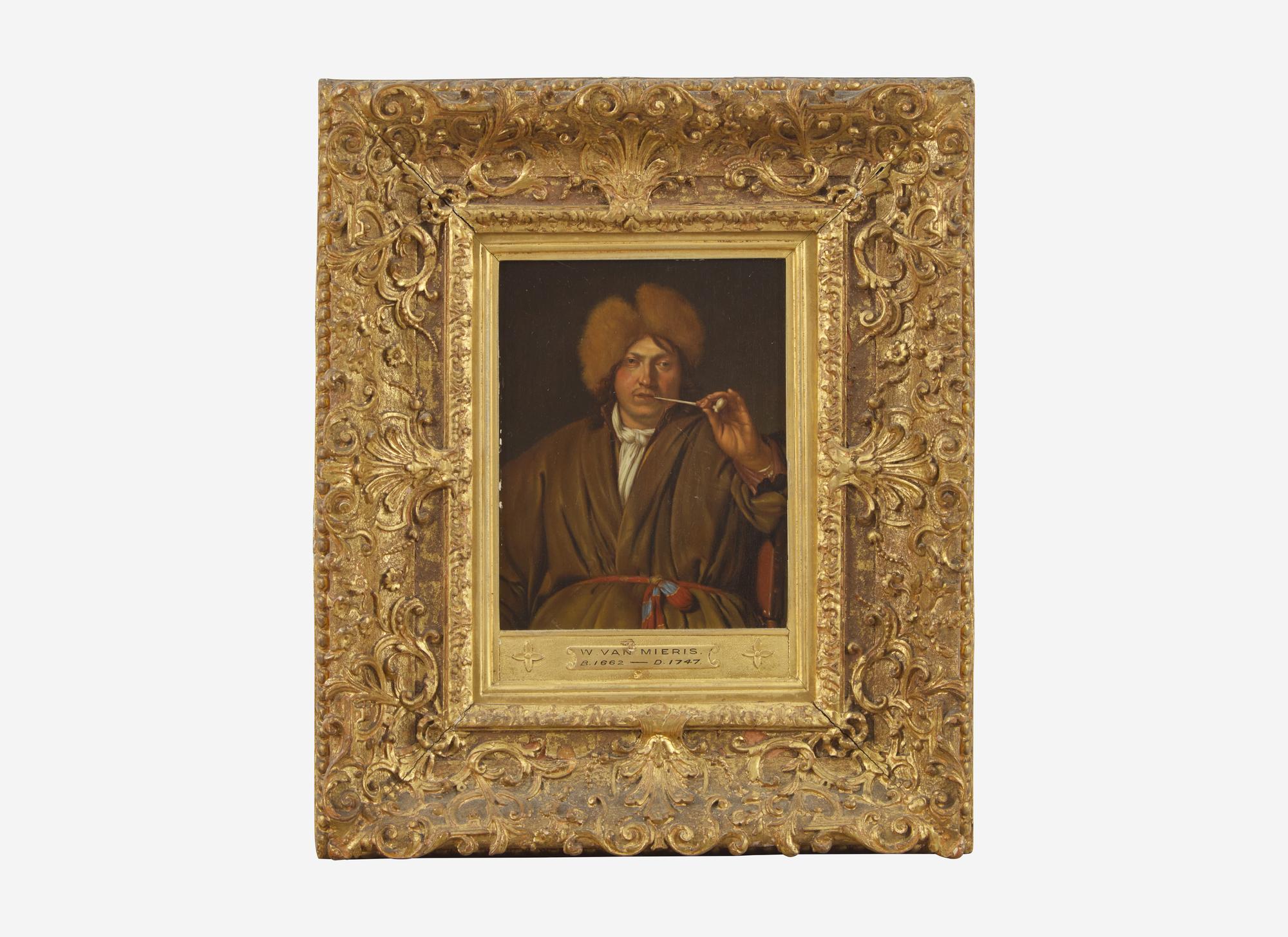 Man Holding a Pipe