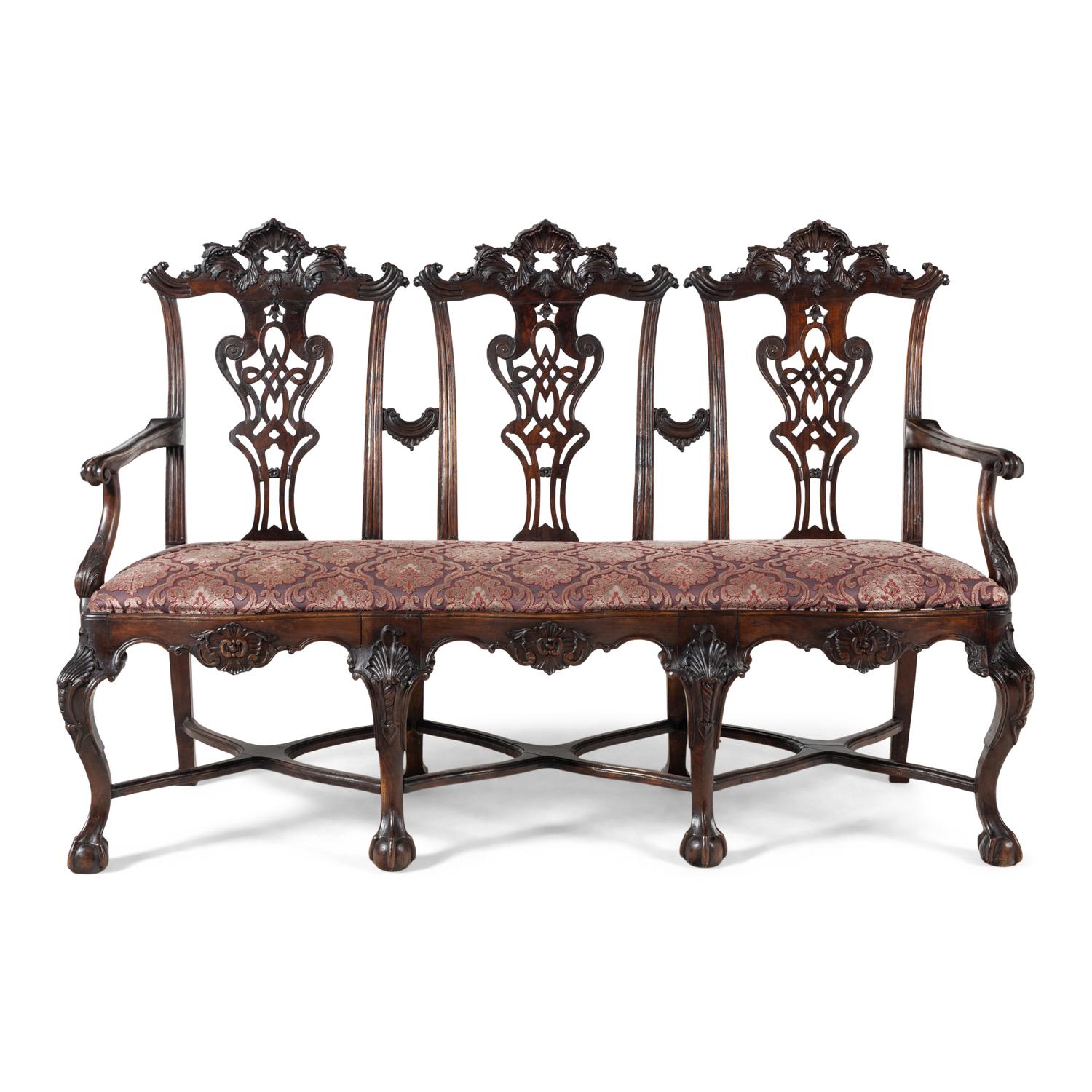 An Italian Rococo Style Carved Mahogany Nine-Piece Seating Suite