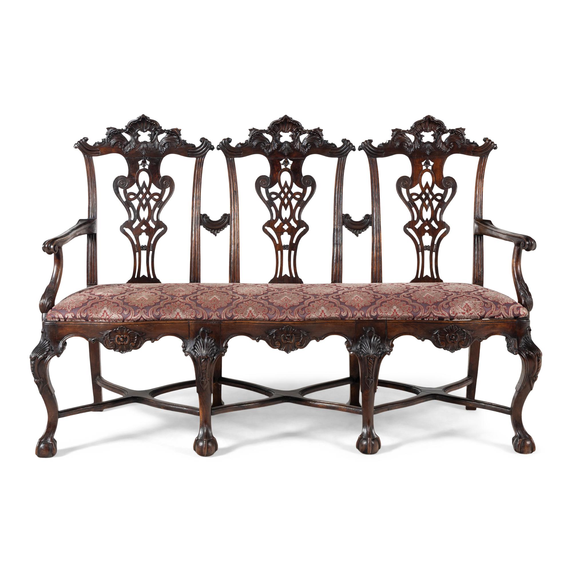 An Italian Rococo Style Carved Mahogany Nine-Piece Seating Suite