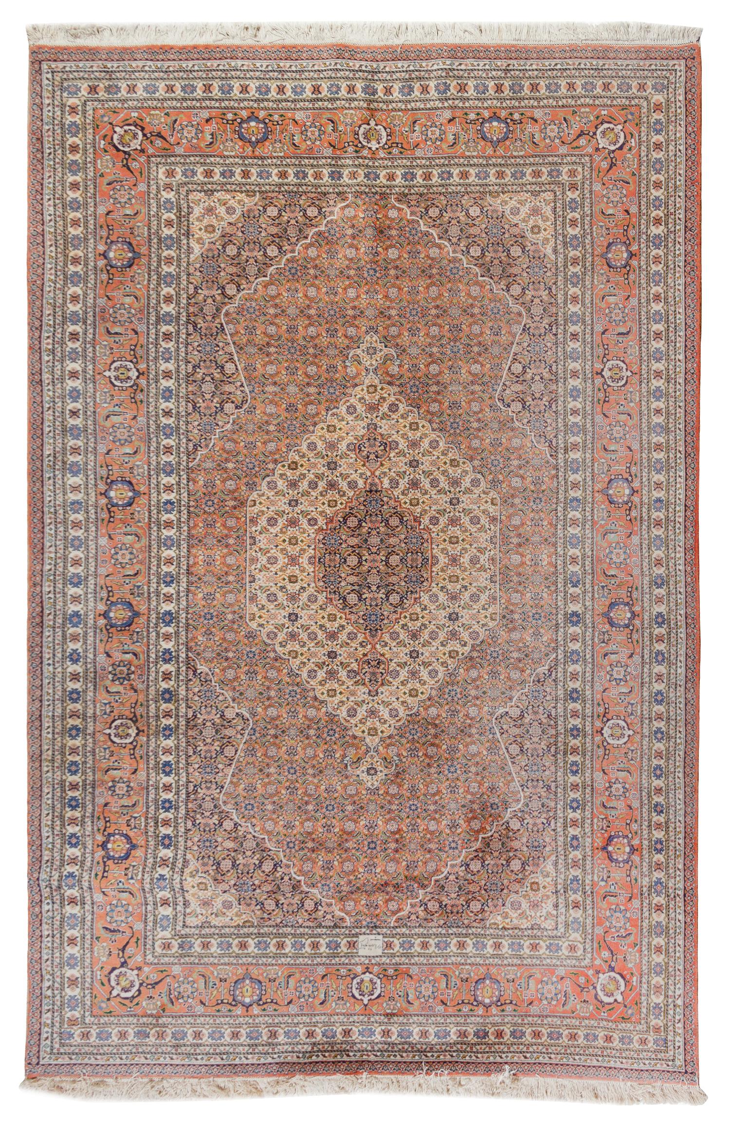 A Tabriz Wool Carpet 9 feet 7 inches x 6 feet 5 inches.