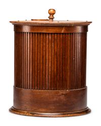 A Merrick's Six Cord Cylindrical Oak Spool Cabinet