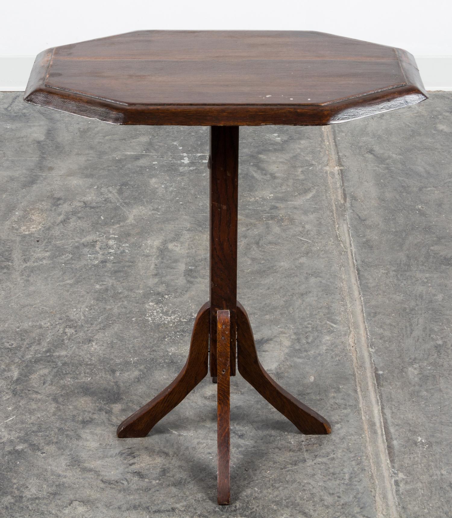 An Arts and Crafts Oak Tilt Top Pedestal Table Height 27 1/2 x width 23 1/2 x depth 14 inches.