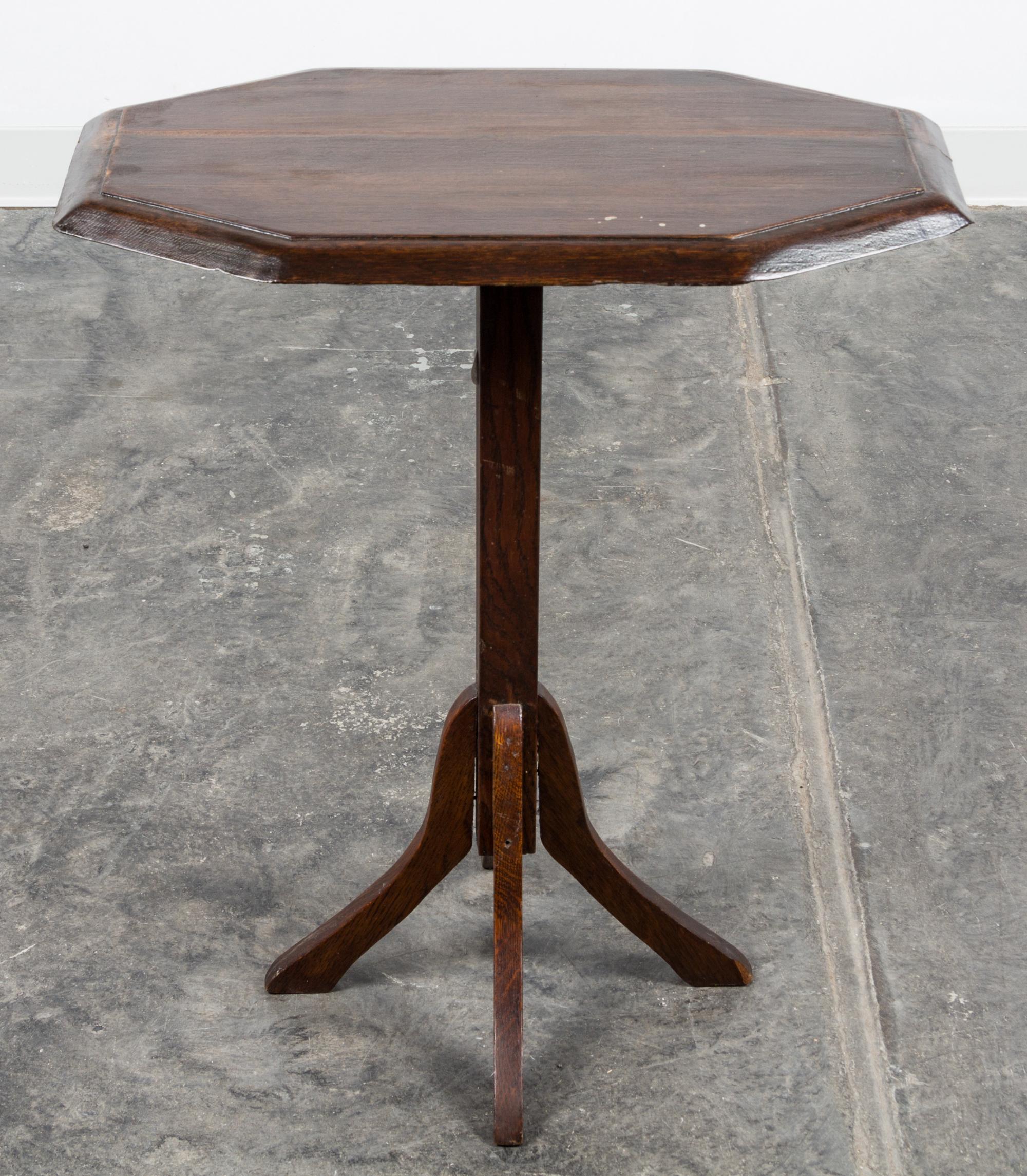 An Arts and Crafts Oak Tilt Top Pedestal Table Height 27 1/2 x width 23 1/2 x depth 14 inches.