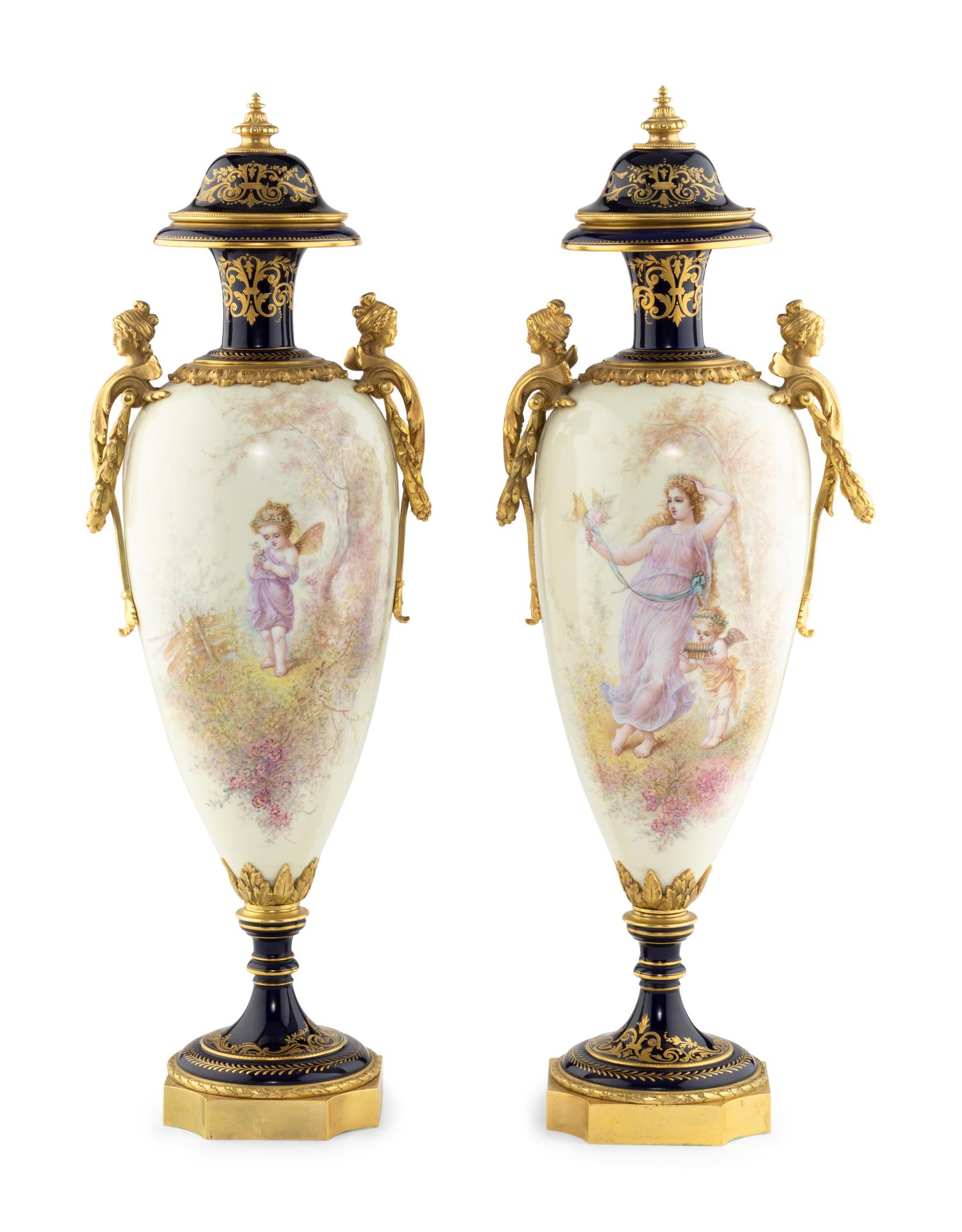 A Pair of Gilt Bronze Mounted Sèvres Style Porcelain Urns