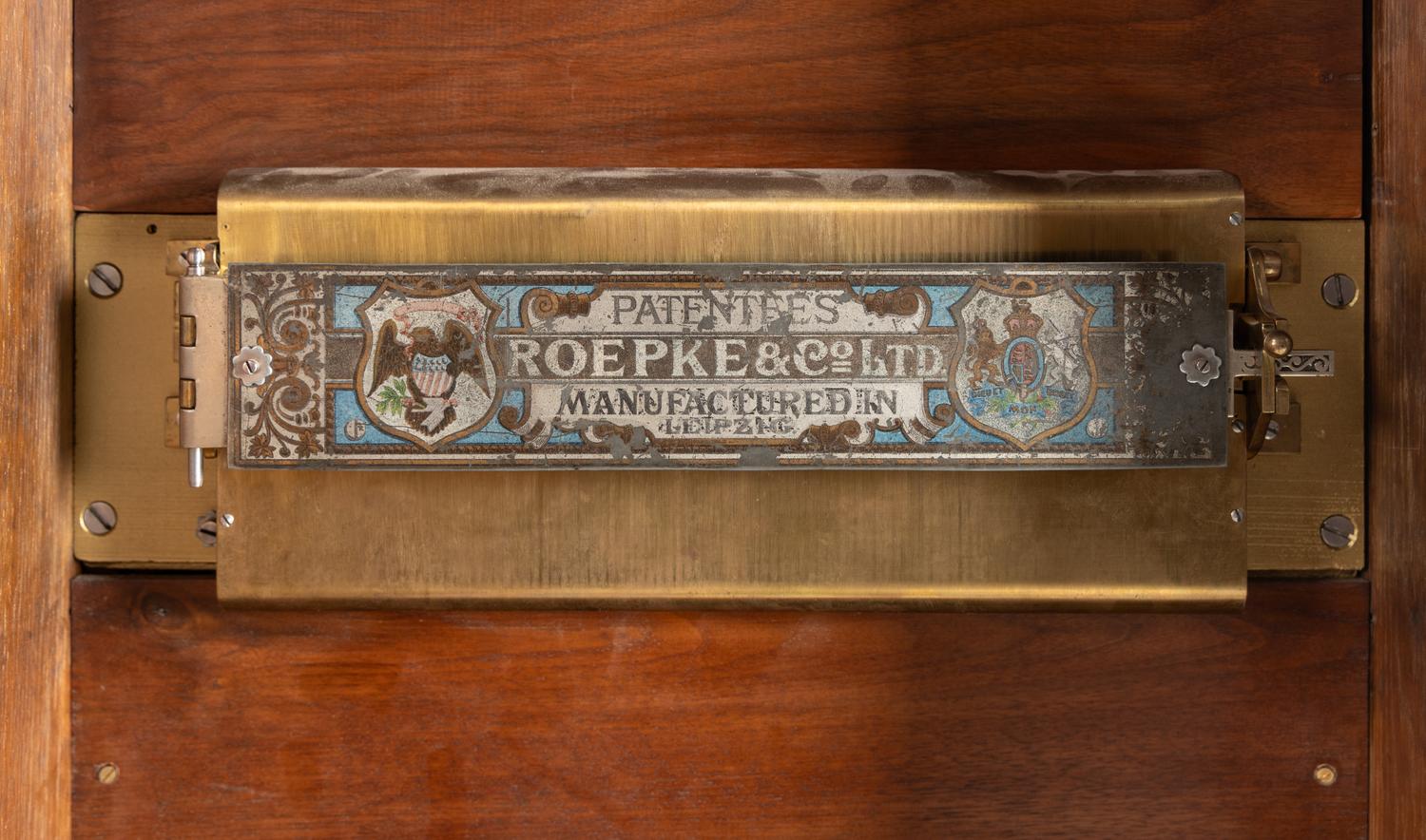 A Roepke Orchestral Book Playing Music Box with Fifteen Books