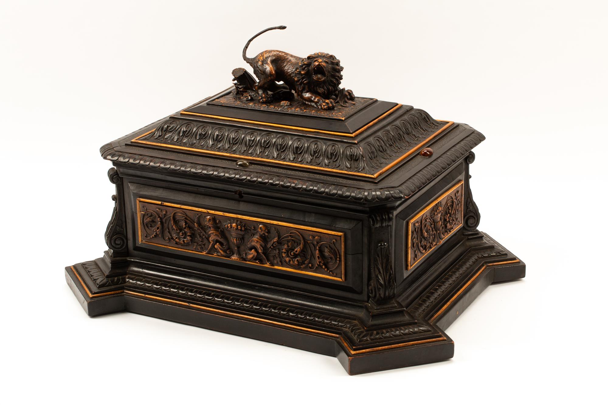 An Austrian Carved and Ebonized Wood Table Casket with a Lion