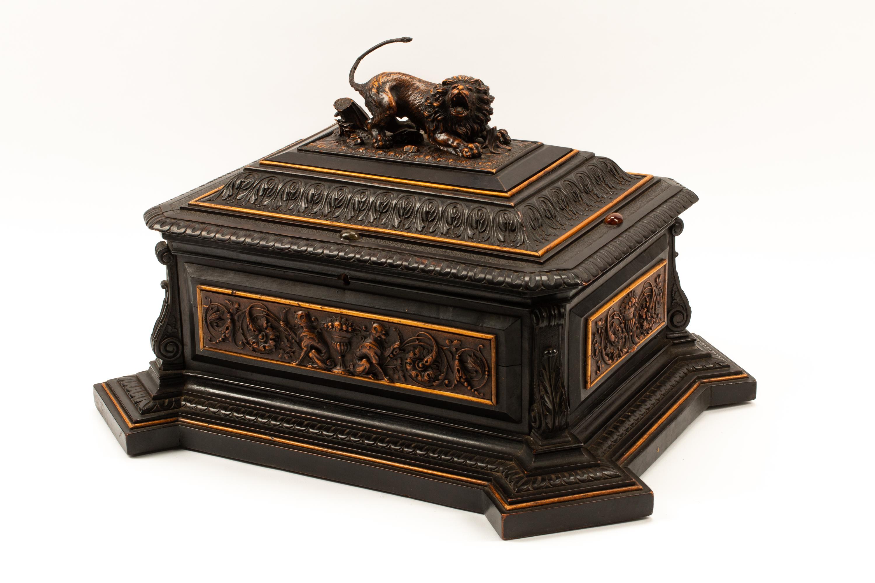 An Austrian Carved and Ebonized Wood Table Casket with a Lion