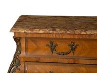 A Régence Style Gilt Metal Mounted Breche d'Alep Marble Top Commode