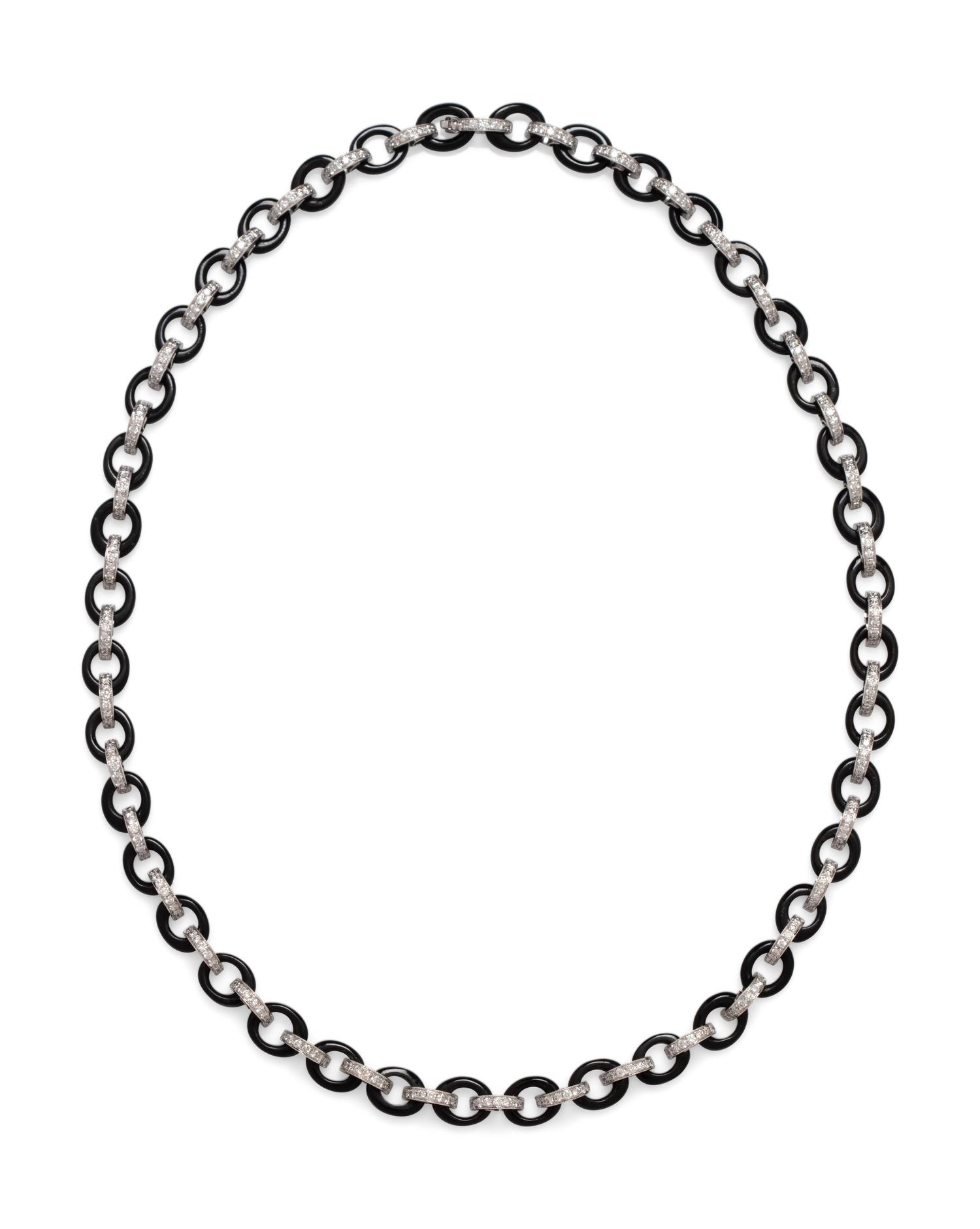 An 18 Karat White Gold, Diamond and Onyx Necklace,