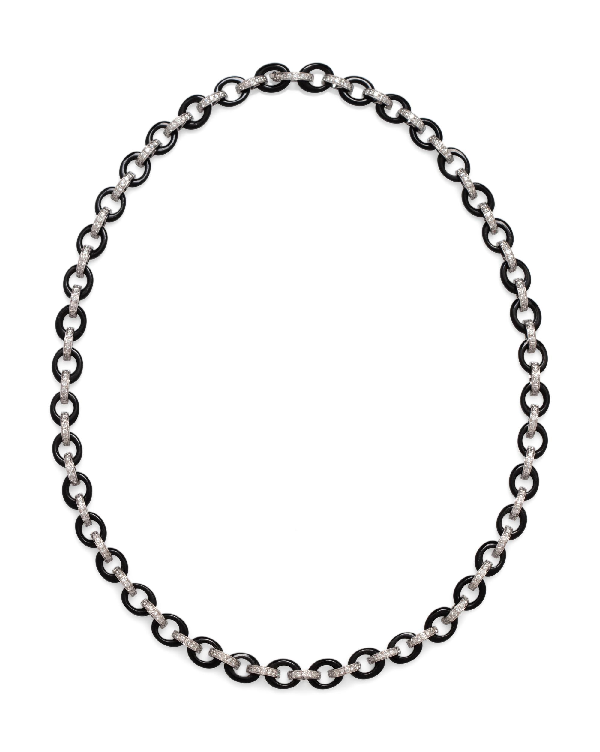 An 18 Karat White Gold, Diamond and Onyx Necklace,
