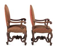 A Pair of Louis XV Style Carved Walnut Fauteuils