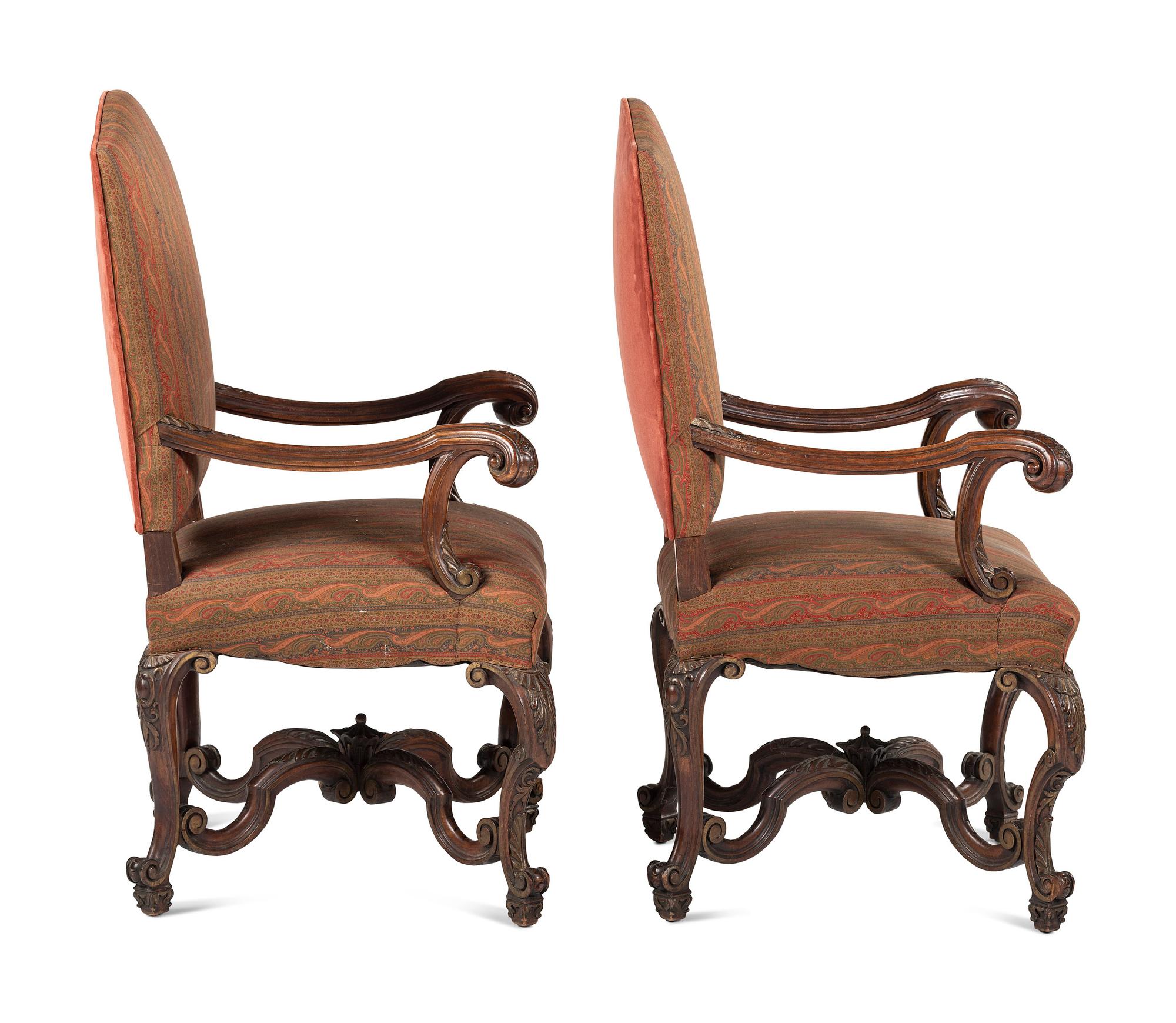 A Pair of Louis XV Style Carved Walnut Fauteuils