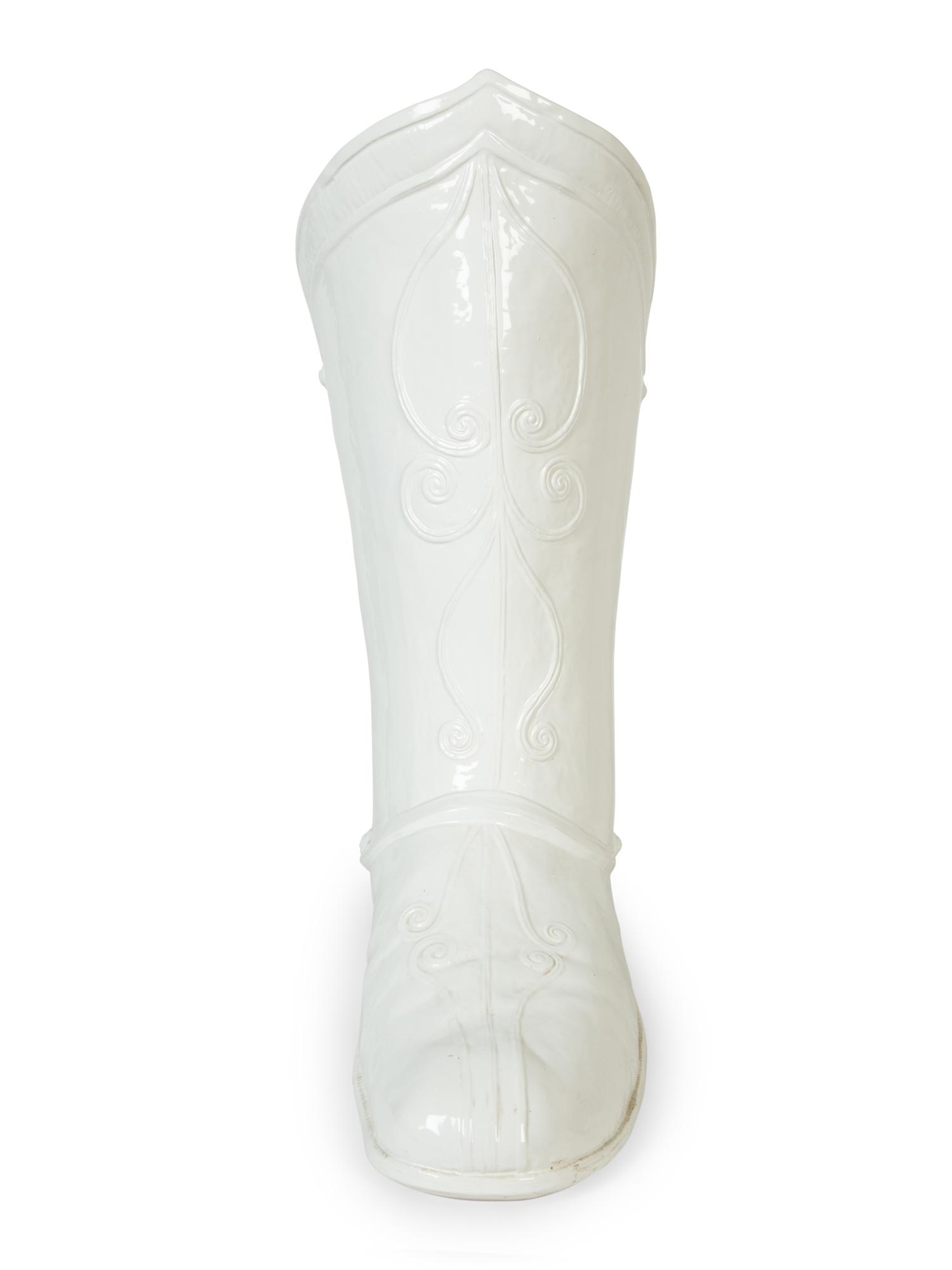 An Italian White-Glazed Earthenware Boot