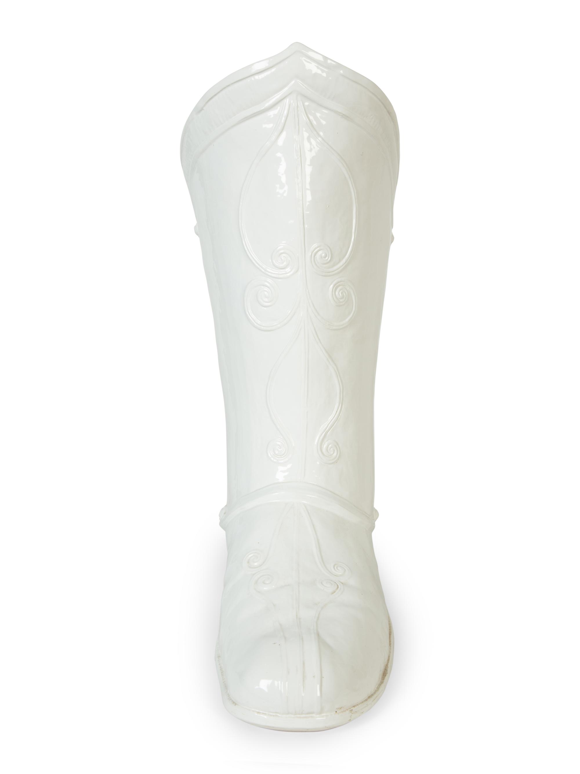 An Italian White-Glazed Earthenware Boot