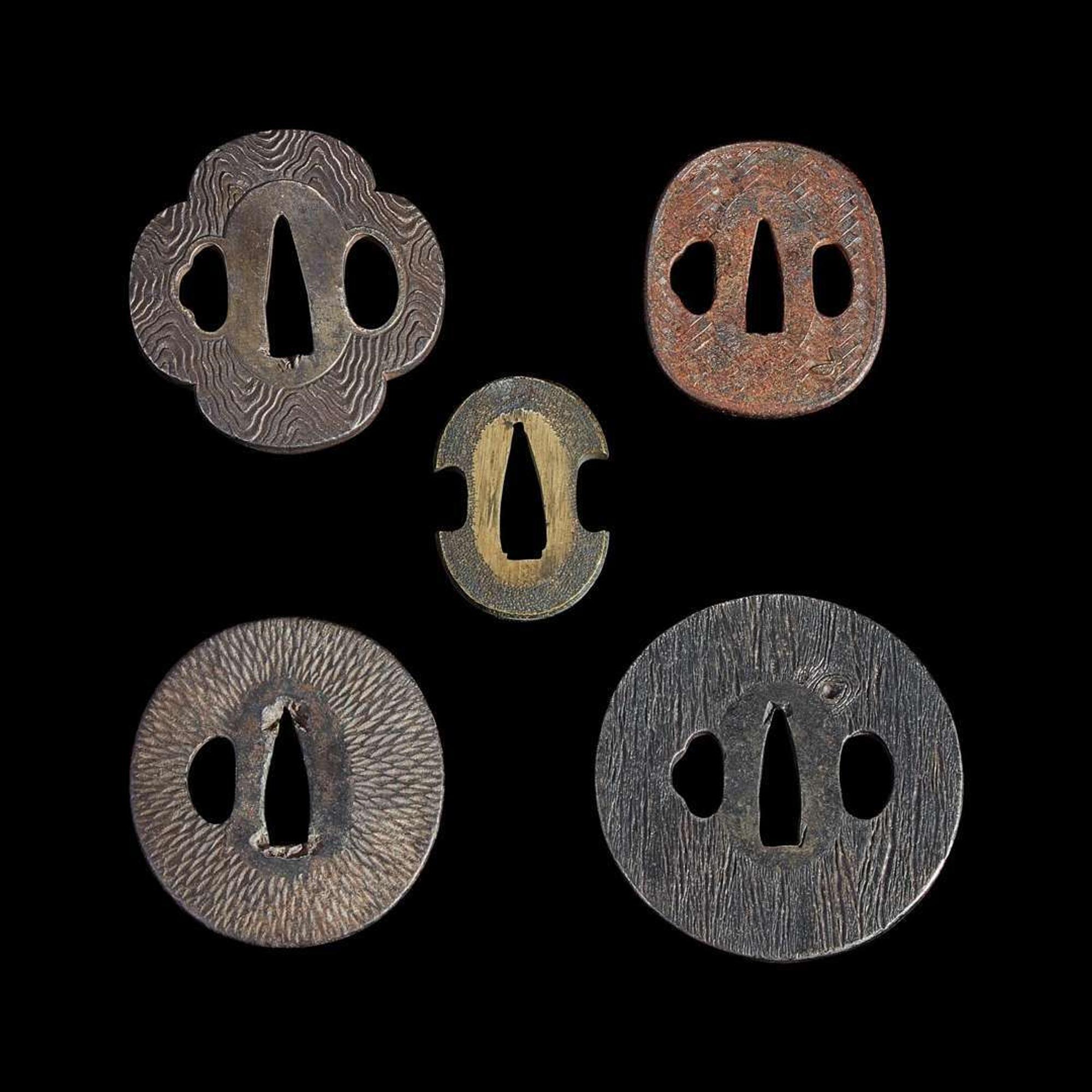 Group of fifteen assorted Japanese tsuba Meiji period and earlier