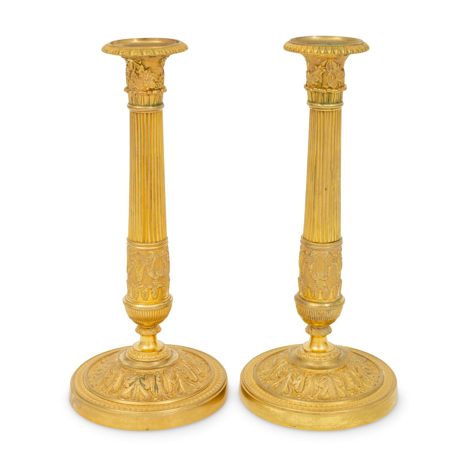 A Pair of French Neoclassical Gilt Bronze Candlesticks