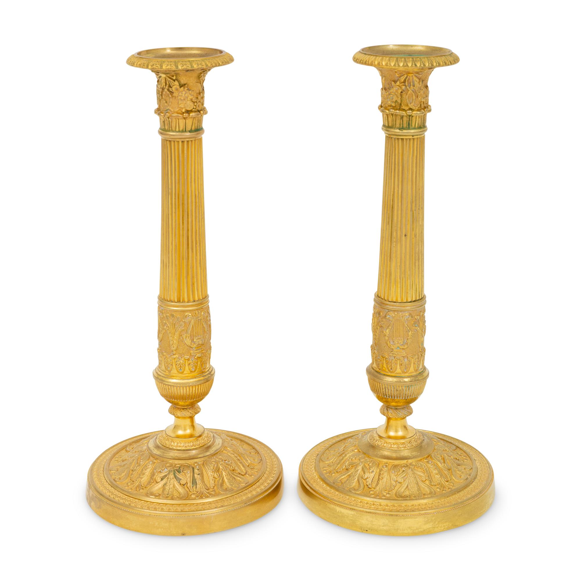 A Pair of French Neoclassical Gilt Bronze Candlesticks
